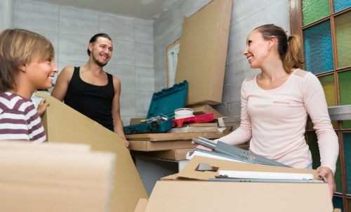 Professional movers loading boxes near Aldgate streets