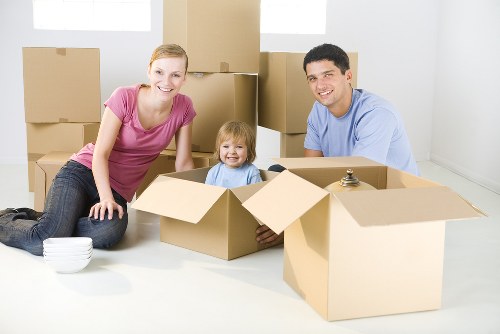 Moving van ready for house removals in Aldgate on a busy London street
