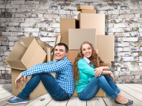 Packed moving boxes and furniture ready for removal services in Aldgate