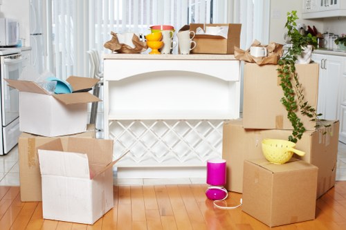 Professional movers using training and protective equipment during a relocation
