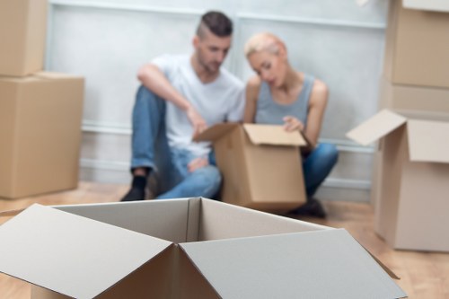 Professional movers loading furniture for a flat or office move in Aldgate