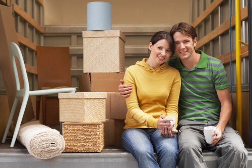 Packed boxes and furniture ready for removals in an Aldgate apartment