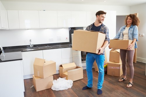 Office furniture and boxes being moved by van