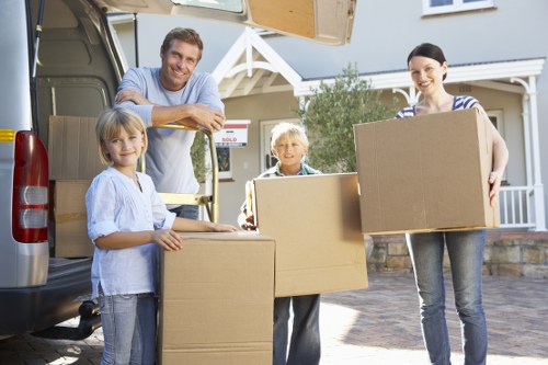 Careful furniture loading during an Aldgate apartment relocation