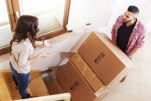 Packed boxes and furniture loaded into a removal truck