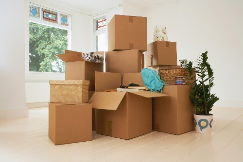 Packing boxes and preparing belongings with house removalists in Aldgate