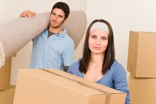Moving van with furniture being unloaded in central London