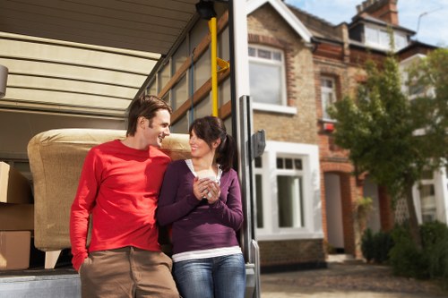 Professional movers handling furniture for a local Aldgate property move
